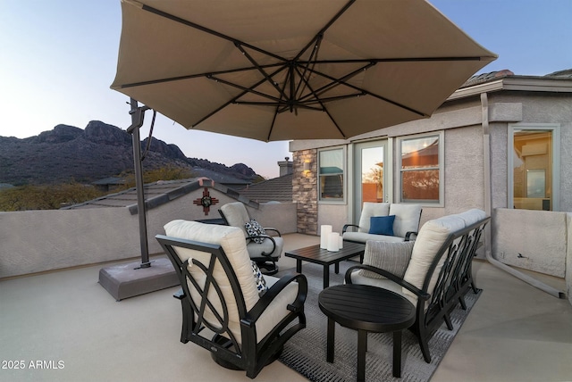 view of patio featuring a mountain view and outdoor lounge area