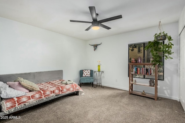 interior space featuring a ceiling fan and baseboards