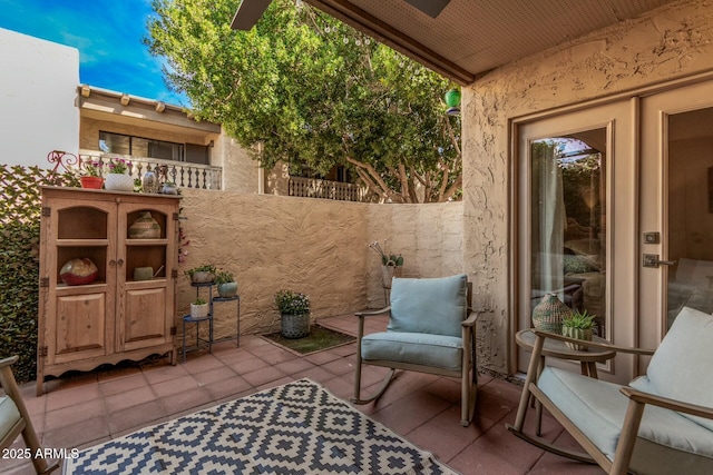 view of patio featuring fence