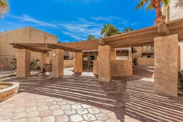 view of patio / terrace with fence and a pergola