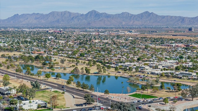 bird's eye view with a water and mountain view