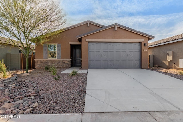 single story home featuring a garage