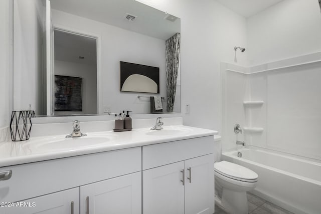 full bathroom featuring tile patterned flooring, vanity,  shower combination, and toilet