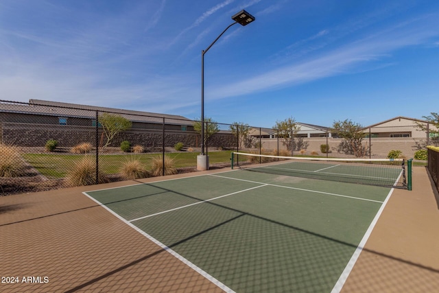 view of sport court with basketball hoop