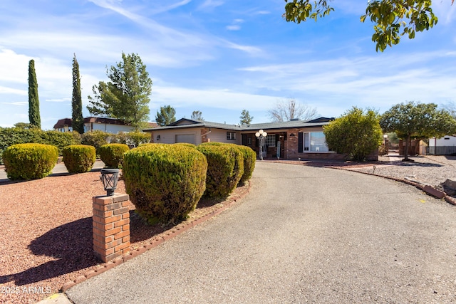 view of front of property with driveway and an attached garage