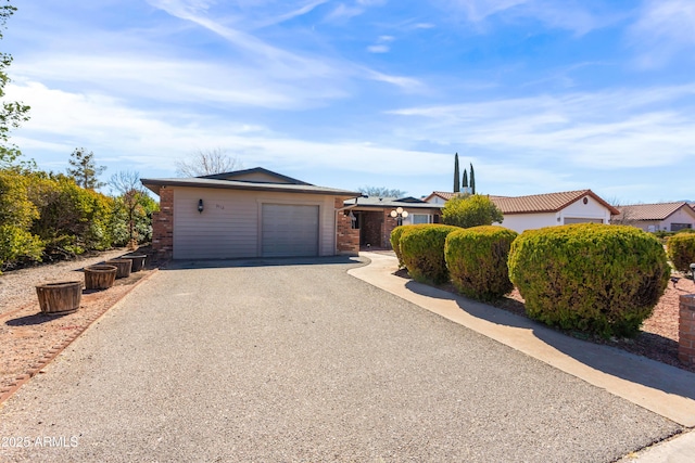 view of front facade with driveway and an attached garage