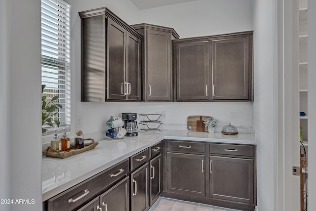 kitchen featuring dark brown cabinetry