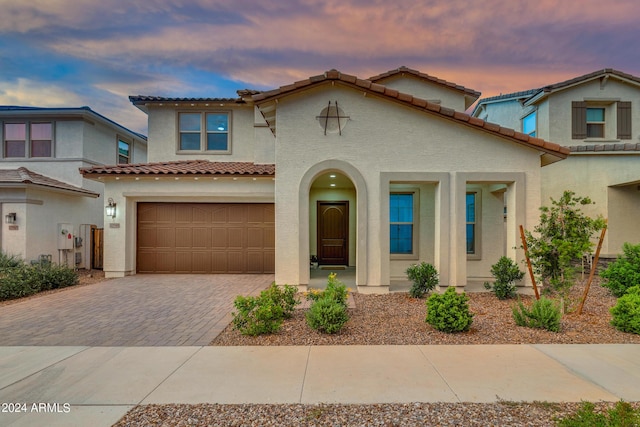 mediterranean / spanish-style house featuring a garage