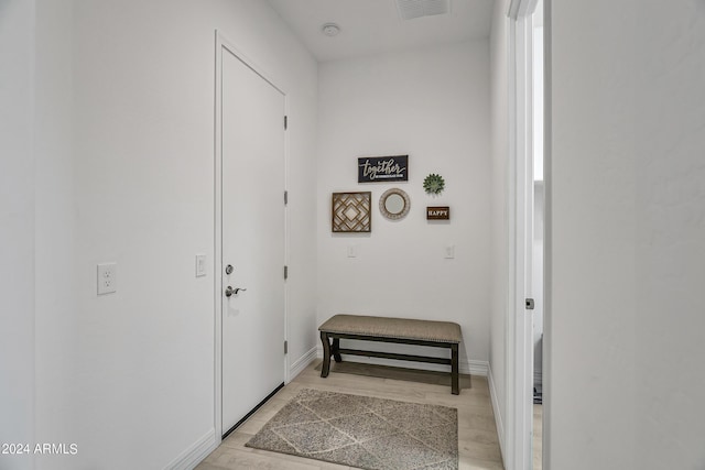 entryway with light hardwood / wood-style flooring