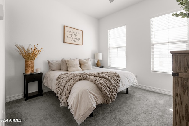 bedroom featuring ceiling fan and carpet floors