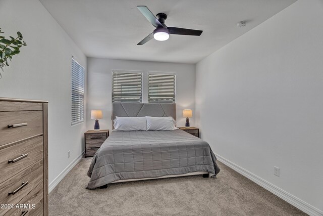 carpeted bedroom featuring ceiling fan