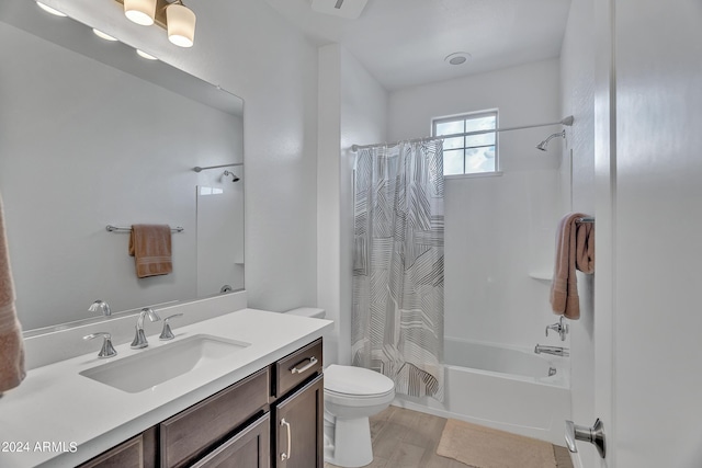 full bathroom featuring shower / bath combination with curtain, vanity, toilet, and hardwood / wood-style floors