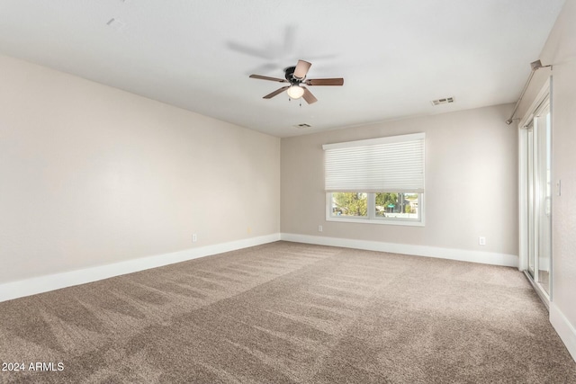 carpeted empty room with ceiling fan