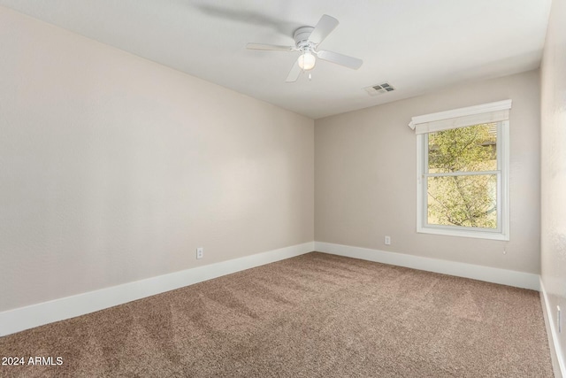 carpeted empty room with ceiling fan