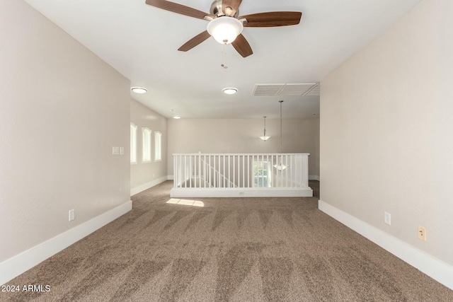 carpeted empty room with ceiling fan