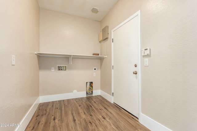 washroom featuring electric dryer hookup, hookup for a washing machine, and hardwood / wood-style floors