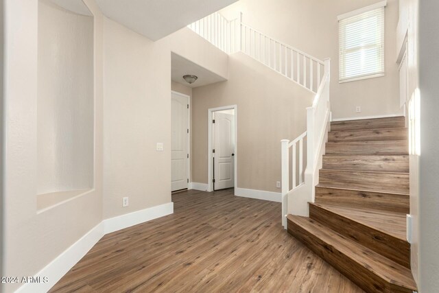 stairway featuring hardwood / wood-style floors