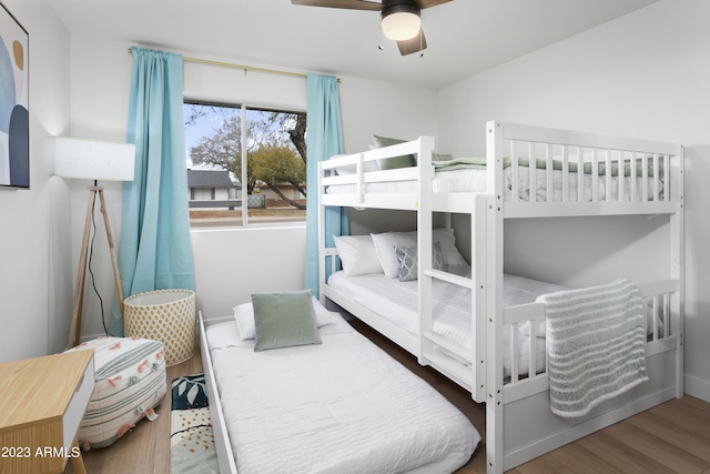 bedroom featuring wood-type flooring and ceiling fan