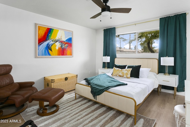 bedroom featuring hardwood / wood-style floors and ceiling fan