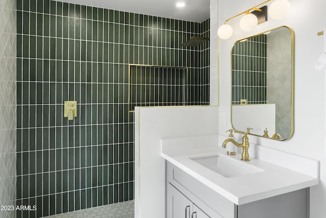 bathroom featuring vanity and a tile shower