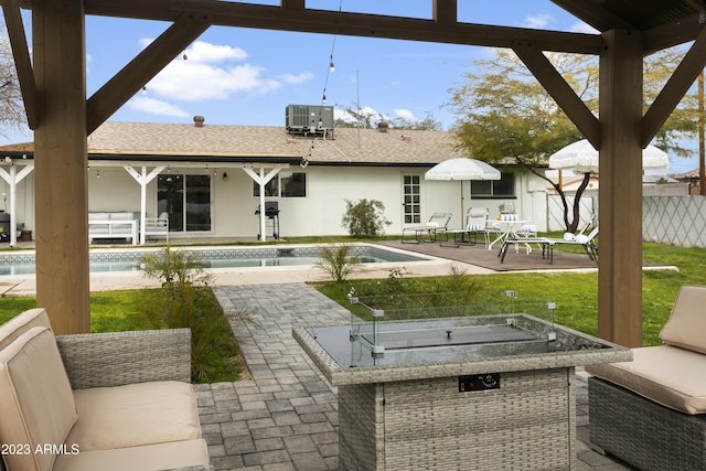 view of patio with central AC and an outdoor living space