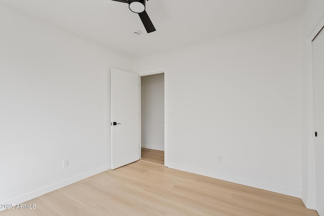 unfurnished room with ceiling fan and light hardwood / wood-style flooring