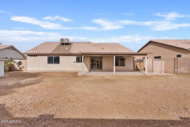 back of property with a patio area