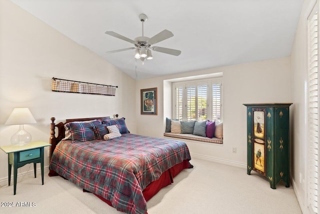 bedroom featuring lofted ceiling, carpet flooring, and ceiling fan