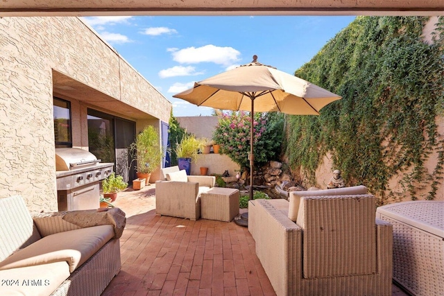 view of patio with area for grilling and an outdoor living space