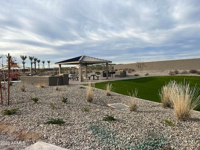 rear view of property featuring a gazebo