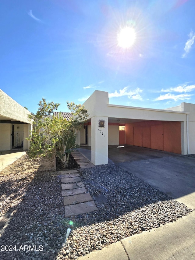 view of front of house with a carport