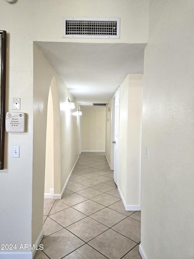 hallway featuring light tile patterned floors