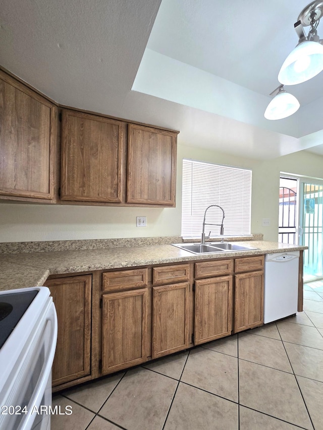 kitchen with sink, light tile patterned floors, and white appliances