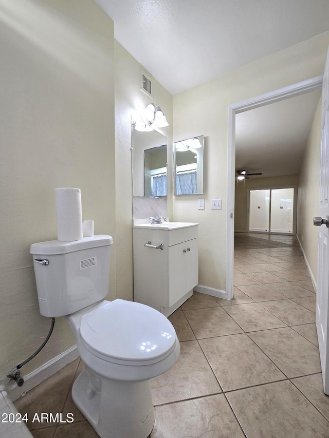 bathroom with vanity, toilet, tile patterned flooring, and ceiling fan