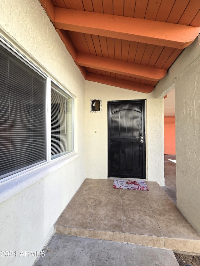 property entrance with a patio