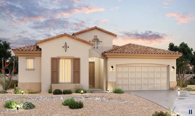 mediterranean / spanish-style house with stucco siding, driveway, a garage, and a tile roof