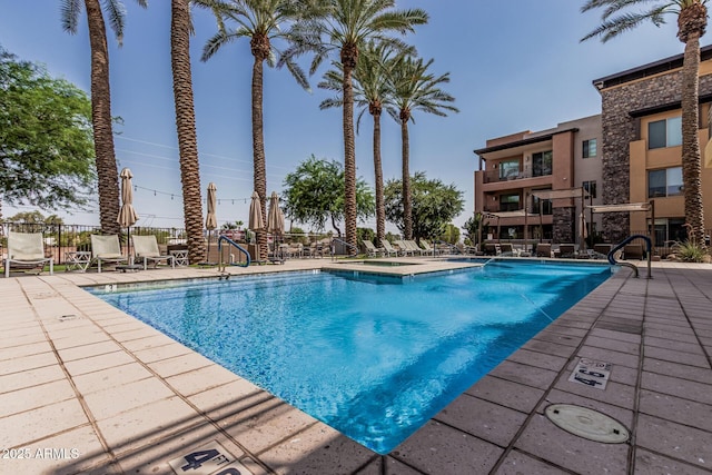 4805 N Woodmere Fairway Unit 1002, Scottsdale, AZ 85251 - community pool with a patio