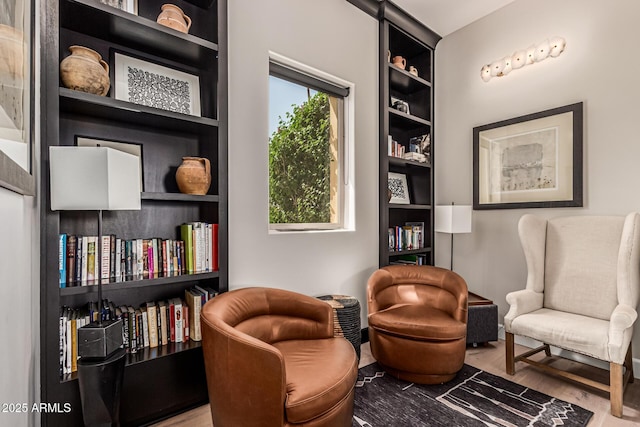 4805 N Woodmere Fairway Unit 1002, Scottsdale, AZ 85251 - sitting room featuring wood finished floors and built in shelves