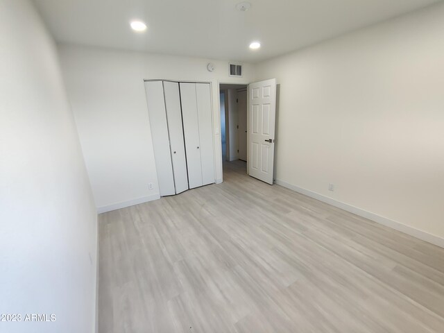 3208 W Bloomfield Rd, Phoenix, AZ 85029 - unfurnished bedroom featuring recessed lighting, baseboards, a closet, and light wood finished floors