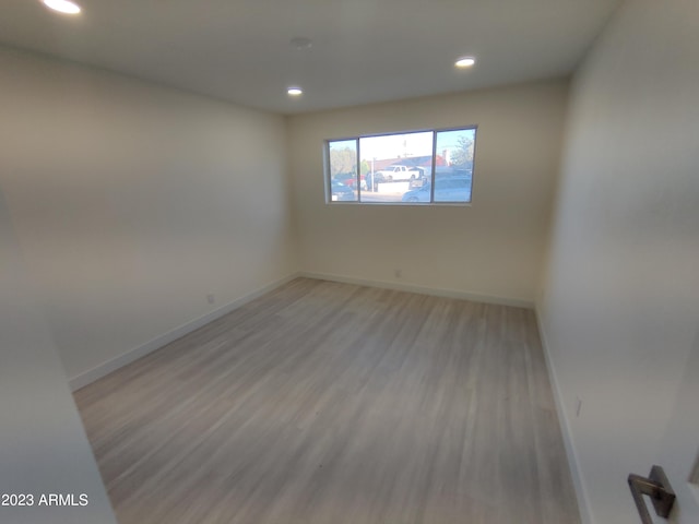 3208 W Bloomfield Rd, Phoenix, AZ 85029 - empty room with recessed lighting, light wood-style flooring, and baseboards