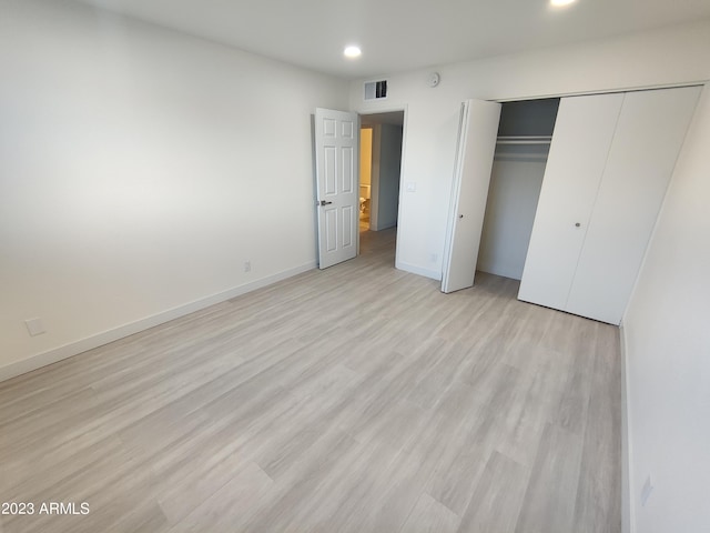 3208 W Bloomfield Rd, Phoenix, AZ 85029 - unfurnished bedroom with recessed lighting, light wood finished floors, a closet, and baseboards