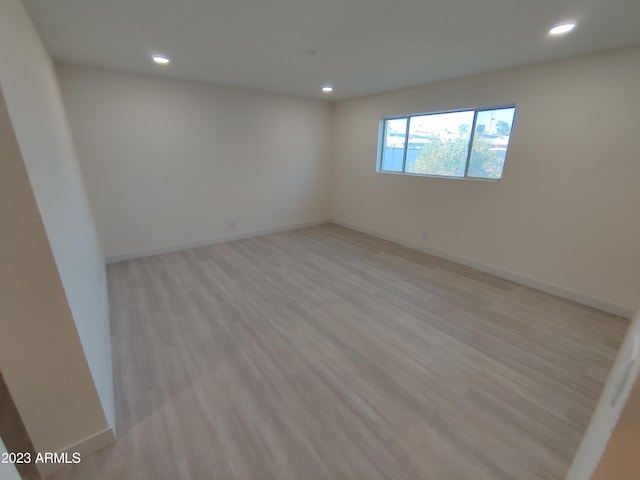 3208 W Bloomfield Rd, Phoenix, AZ 85029 - empty room with recessed lighting, light wood-style floors, and baseboards