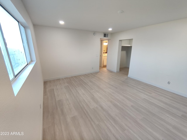 3208 W Bloomfield Rd, Phoenix, AZ 85029 - spare room featuring recessed lighting, light wood-style floors, and baseboards