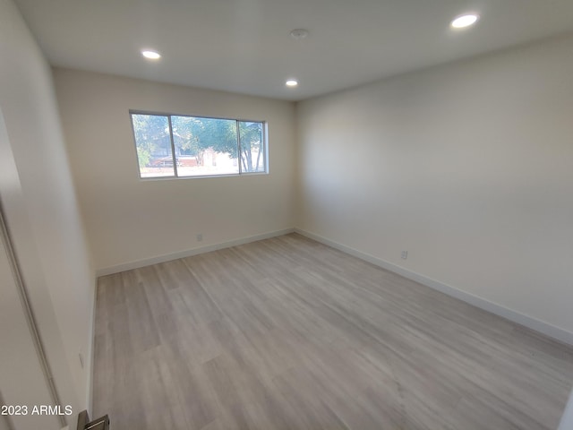 3208 W Bloomfield Rd, Phoenix, AZ 85029 - unfurnished room featuring recessed lighting, light wood-style floors, and baseboards