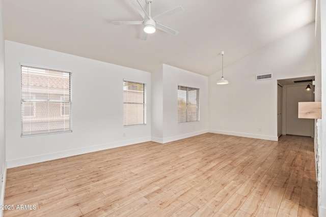 unfurnished living room featuring a ceiling fan, light wood-style floors, high vaulted ceiling, and baseboards