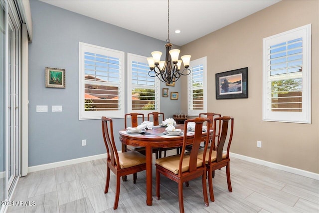 dining space featuring an inviting chandelier