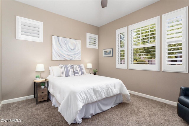 bedroom with ceiling fan and carpet floors