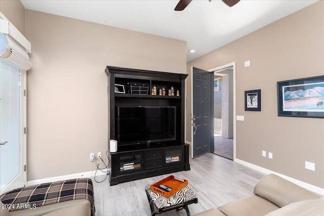 living room with hardwood / wood-style floors and ceiling fan