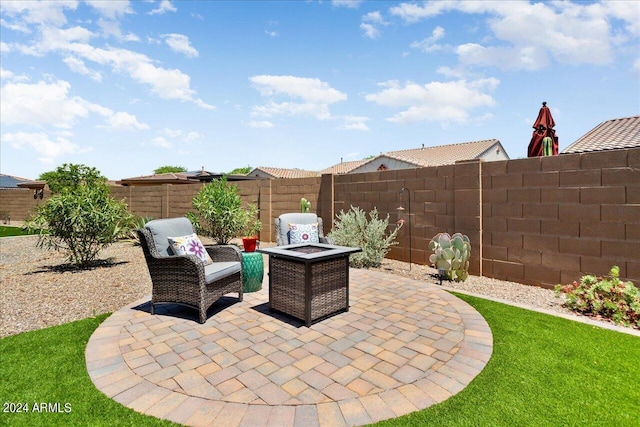 view of patio with an outdoor fire pit