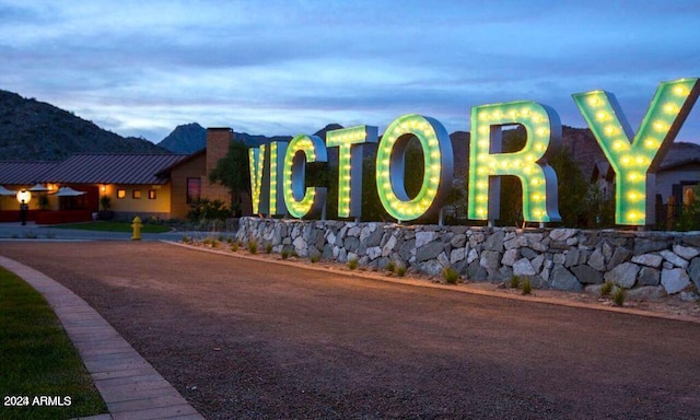 community sign featuring a mountain view